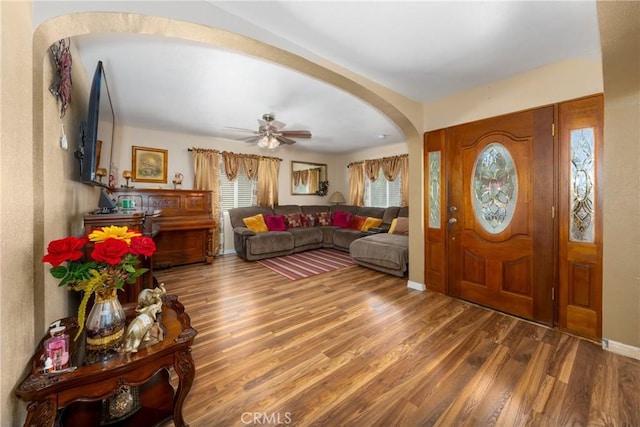 795 E 42nd Pl, Los Angeles, CA 90011 - foyer with arched walkways, wood finished floors, and a ceiling fan