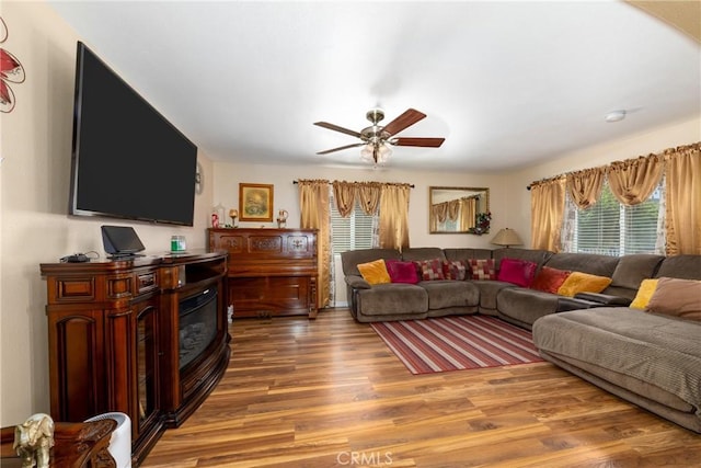 795 E 42nd Pl, Los Angeles, CA 90011 - living room with wood finished floors, healthy amount of natural light, and ceiling fan