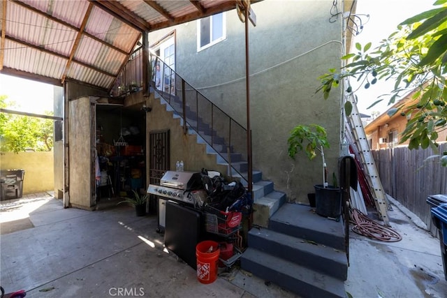 795 E 42nd Pl, Los Angeles, CA 90011 - view of patio featuring stairway and a grill