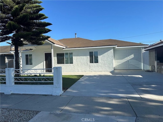 350 E 223rd St, Carson, CA 90745 - view of front of property with stucco siding, driveway, roof with shingles, and an attached garage