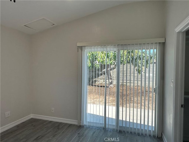 350 E 223rd St, Carson, CA 90745 - spare room featuring lofted ceiling, dark wood-style flooring, and attic access