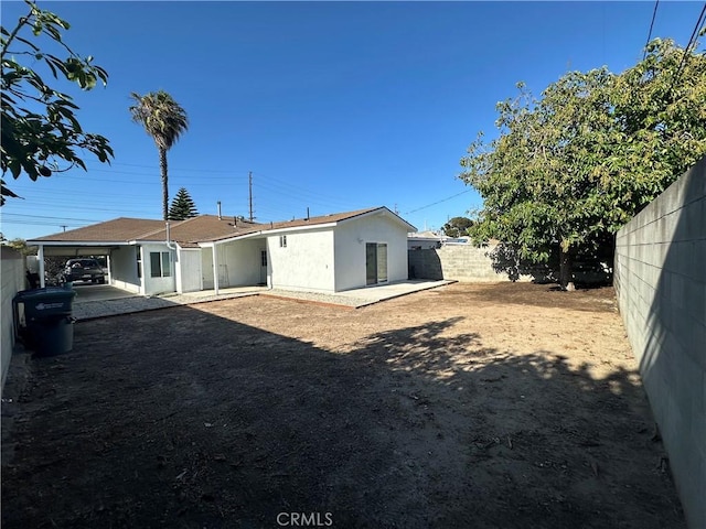 350 E 223rd St, Carson, CA 90745 - rear view of property with a fenced backyard and stucco siding