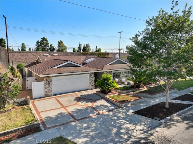 6152 Anthony Ave, Garden Grove, CA 92845 - ranch-style home featuring stone siding, driveway, a garage, and a shingled roof