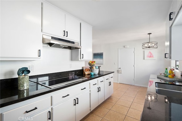 6152 Anthony Ave, Garden Grove, CA 92845 - kitchen featuring under cabinet range hood, black electric stovetop, white cabinetry, light tile patterned floors, and a chandelier