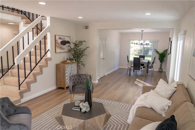 12 Ninos, Irvine, CA 92620 - living area with a chandelier, stairway, wood finished floors, and recessed lighting
