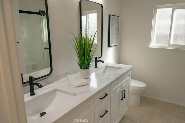 12 Ninos, Irvine, CA 92620 - bathroom featuring double vanity and a shower with shower door