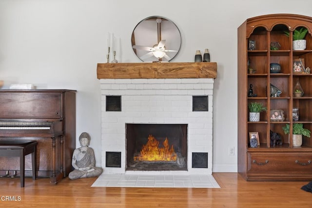 995 S La Luna Ave, Ojai, CA 93023 - living area with a brick fireplace, wood finished floors, and ceiling fan