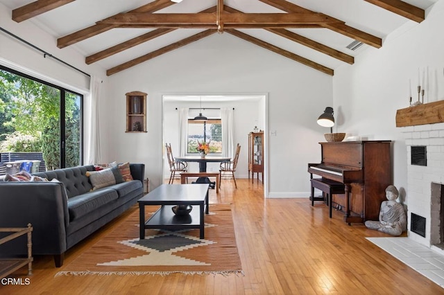 995 S La Luna Ave, Ojai, CA 93023 - living room with a fireplace, light wood-type flooring, beamed ceiling, and high vaulted ceiling