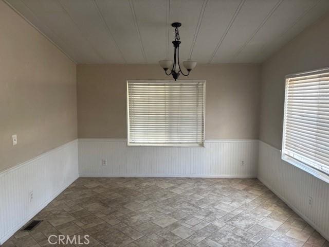 10220 Wrangler Way, Corona, CA 92883 - spare room with wainscoting