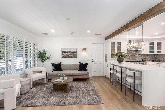 22608 Crespi St, Woodland Hills, CA 91364 - living area featuring recessed lighting, light wood finished floors, and beam ceiling