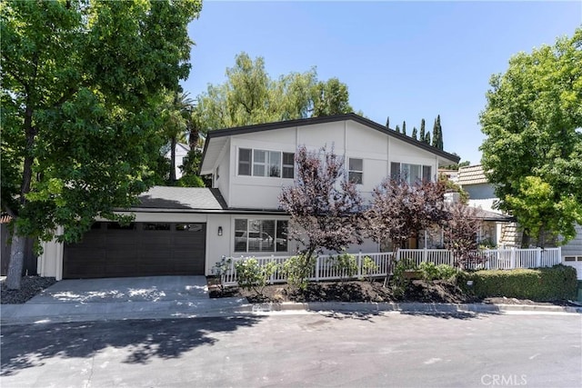 22608 Crespi St, Woodland Hills, CA 91364 - view of front facade with driveway and an attached garage