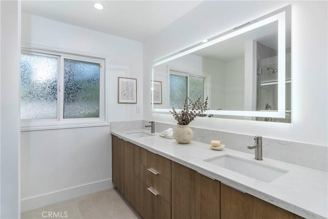22608 Crespi St, Woodland Hills, CA 91364 - bathroom featuring double vanity, plenty of natural light, tile patterned floors, and a shower