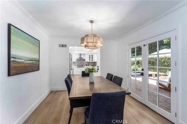 22608 Crespi St, Woodland Hills, CA 91364 - dining room with light wood finished floors, crown molding, a chandelier, and french doors