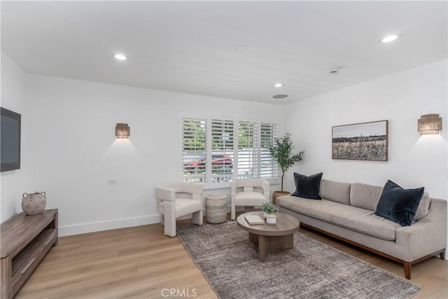 22608 Crespi St, Woodland Hills, CA 91364 - living area featuring light wood-style flooring and recessed lighting