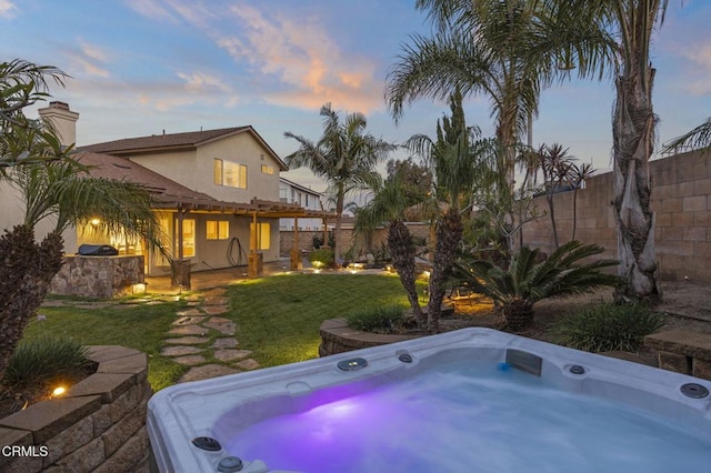1531 Daphne Ave, Ventura, CA 93004 - back of property featuring stucco siding, a hot tub, a chimney, and a balcony