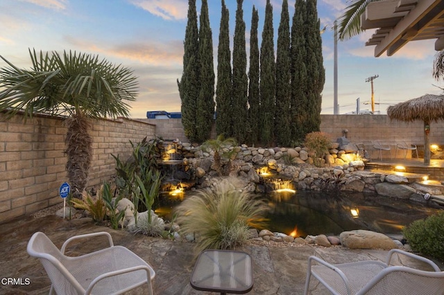 1531 Daphne Ave, Ventura, CA 93004 - fenced backyard featuring a fire pit and a small pond