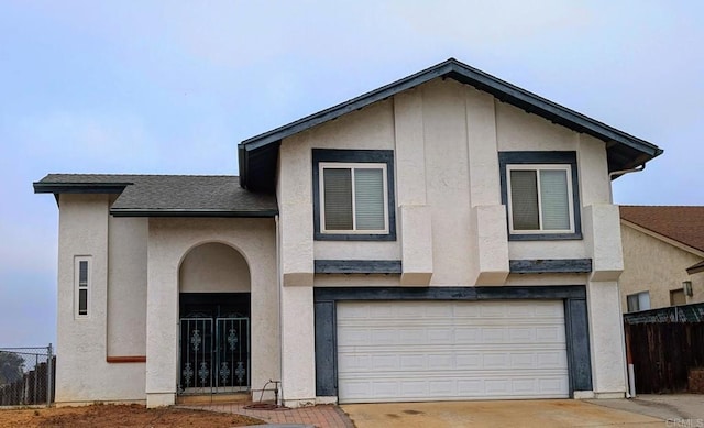1660 Lomacita Ter, El Cajon, CA 92021 - view of front facade with driveway, stucco siding, and a garage