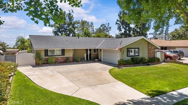 1052 Golden Rain St, Upland, CA 91786 - single story home with concrete driveway, a gate, an attached garage, and roof with shingles
