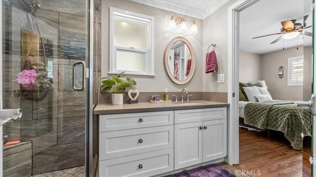 1052 Golden Rain St, Upland, CA 91786 - ensuite bathroom with vanity, crown molding, a ceiling fan, a stall shower, and wood finished floors