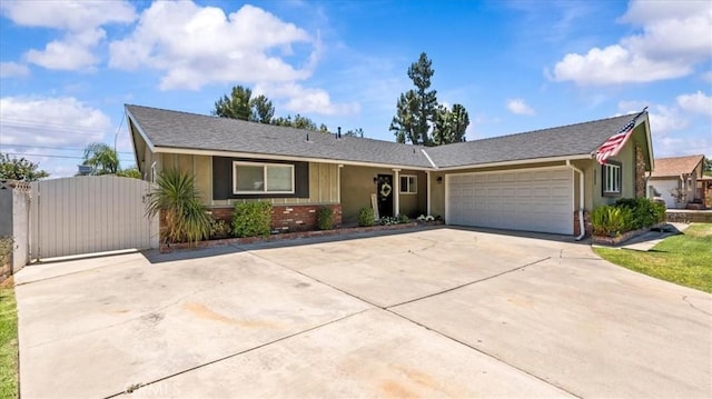 1052 Golden Rain St, Upland, CA 91786 - ranch-style house featuring driveway, an attached garage, and a gate
