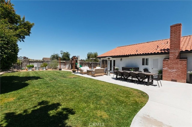 348 Clubhouse Dr, Santa Maria, CA 93455 - fenced backyard featuring a playground, an outdoor living space, and a patio area