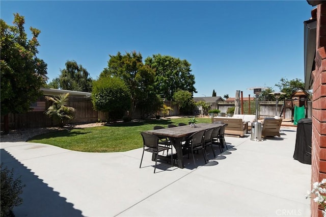 348 Clubhouse Dr, Santa Maria, CA 93455 - fenced backyard with a patio area, an outdoor hangout area, and outdoor dining space