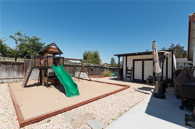 348 Clubhouse Dr, Santa Maria, CA 93455 - view of jungle gym with a fenced backyard, a storage shed, and a patio area
