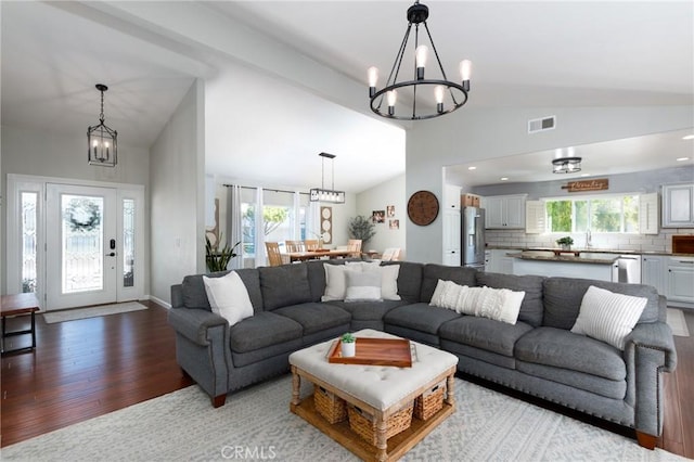 348 Clubhouse Dr, Santa Maria, CA 93455 - living room with vaulted ceiling, a chandelier, and wood finished floors