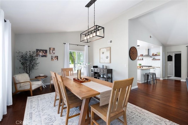 348 Clubhouse Dr, Santa Maria, CA 93455 - dining space with vaulted ceiling and dark wood-style floors
