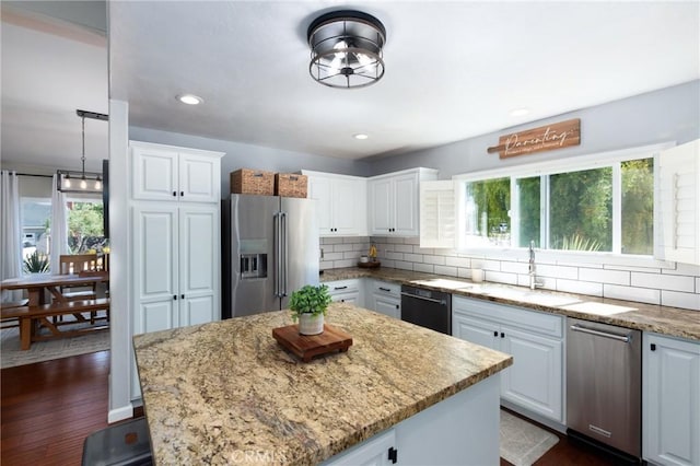 348 Clubhouse Dr, Santa Maria, CA 93455 - kitchen with high end fridge, black dishwasher, plenty of natural light, decorative backsplash, and recessed lighting