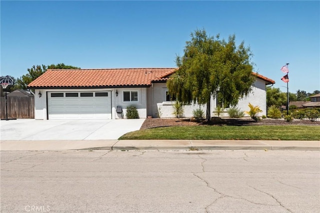 348 Clubhouse Dr, Santa Maria, CA 93455 - mediterranean / spanish house with a tiled roof, an attached garage, driveway, and stucco siding