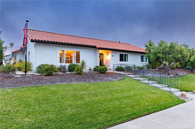 348 Clubhouse Dr, Santa Maria, CA 93455 - mediterranean / spanish house with a front lawn, a tiled roof, and stucco siding