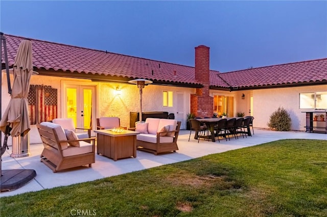 348 Clubhouse Dr, Santa Maria, CA 93455 - rear view of house featuring an outdoor living space with a fire pit, a tiled roof, a chimney, a yard, and a patio area