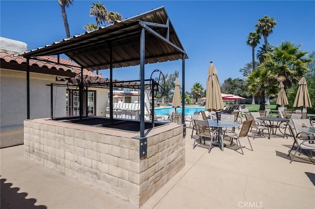 348 Clubhouse Dr, Santa Maria, CA 93455 - view of patio featuring a community pool and a pergola