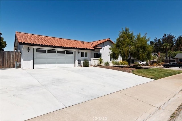 348 Clubhouse Dr, Santa Maria, CA 93455 - mediterranean / spanish home with a tile roof, driveway, an attached garage, and stucco siding