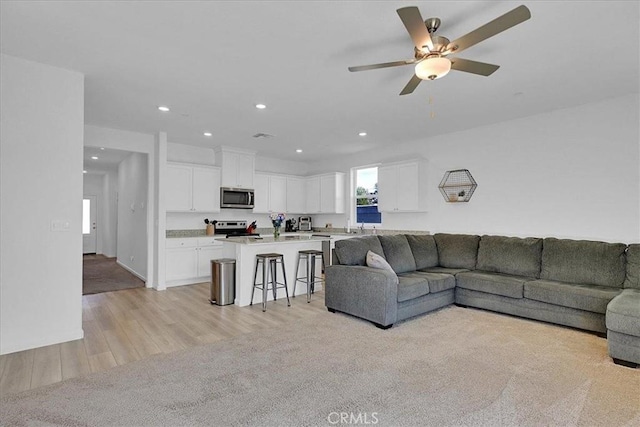 5516 Sunhaven St, Marysville, CA 95901 - living area featuring light wood finished floors, a ceiling fan, and recessed lighting