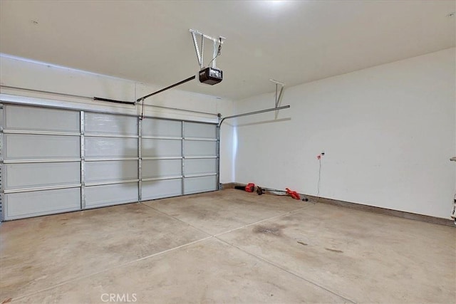 5516 Sunhaven St, Marysville, CA 95901 - garage featuring a garage door opener and baseboards