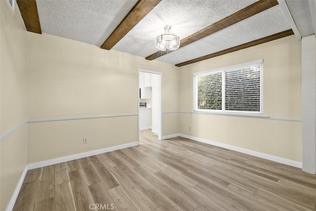 3262 Avenida Simi, Simi Valley, CA 93063 - unfurnished room with beamed ceiling, a chandelier, light wood-style floors, and a textured ceiling