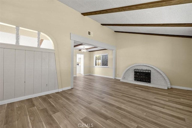 3262 Avenida Simi, Simi Valley, CA 93063 - unfurnished living room featuring a textured ceiling, a fireplace, wood finished floors, and a chandelier