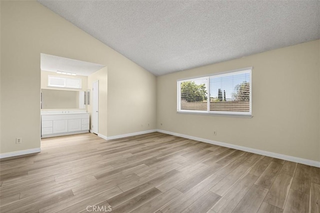 3262 Avenida Simi, Simi Valley, CA 93063 - unfurnished room with vaulted ceiling, a textured ceiling, and light wood-style floors