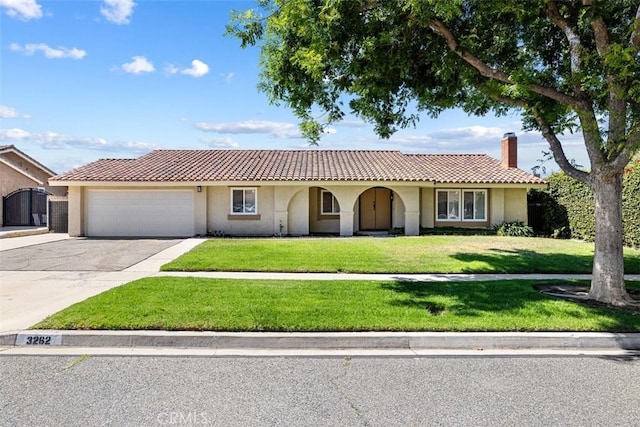 3262 Avenida Simi, Simi Valley, CA 93063 - mediterranean / spanish home featuring stucco siding, a front lawn, driveway, and an attached garage