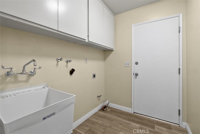 3262 Avenida Simi, Simi Valley, CA 93063 - laundry room with electric dryer hookup, light wood-style floors, cabinet space, hookup for a gas dryer, and hookup for a washing machine