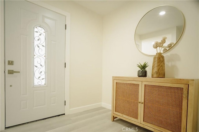 722 W Cully Dr, Orange, CA 92865 - entryway with baseboards and wood finished floors