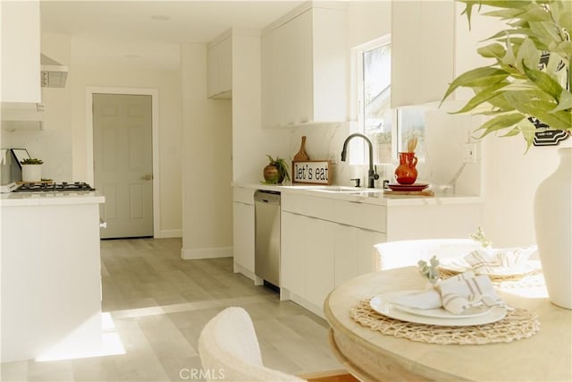 722 W Cully Dr, Orange, CA 92865 - kitchen with tasteful backsplash, stainless steel dishwasher, and light countertops