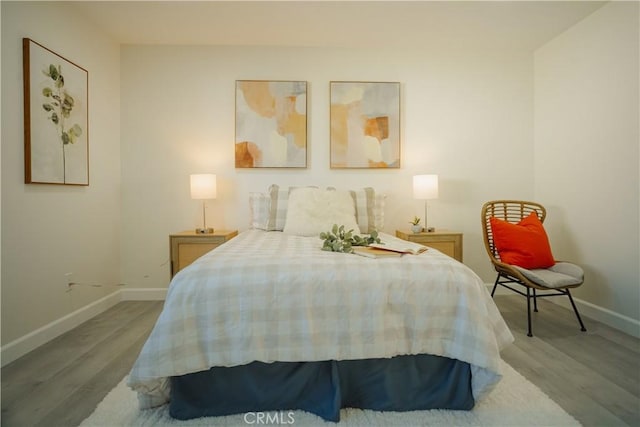 722 W Cully Dr, Orange, CA 92865 - bedroom featuring wood finished floors and baseboards