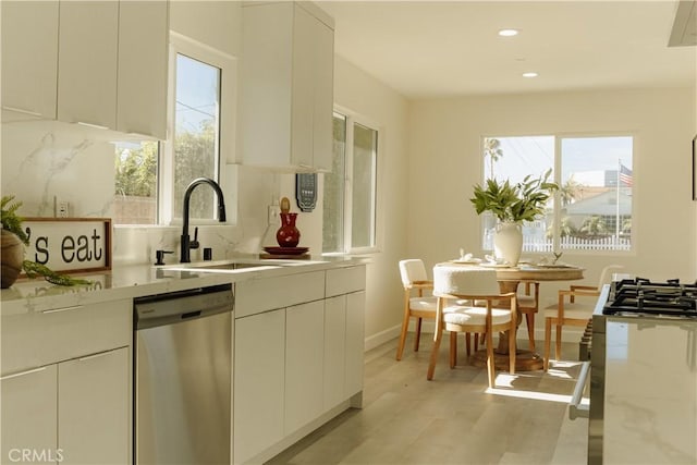 722 W Cully Dr, Orange, CA 92865 - kitchen with dishwasher, modern cabinets, light wood-type flooring, recessed lighting, and light stone countertops