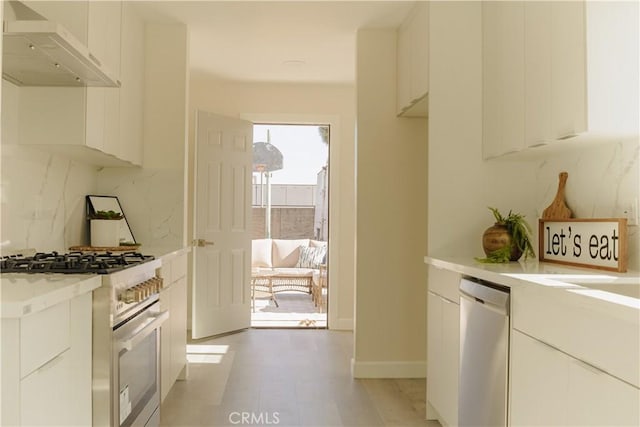 722 W Cully Dr, Orange, CA 92865 - kitchen with appliances with stainless steel finishes, custom range hood, light countertops, white cabinetry, and modern cabinets