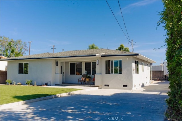722 W Cully Dr, Orange, CA 92865 - back of house with stucco siding, a yard, driveway, and crawl space