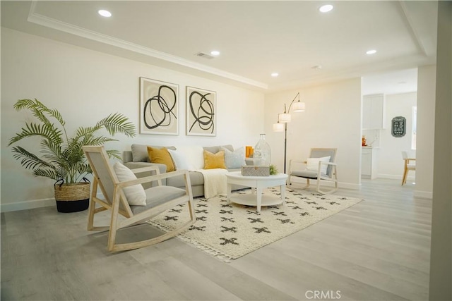 722 W Cully Dr, Orange, CA 92865 - living area with light wood finished floors, a raised ceiling, recessed lighting, and crown molding