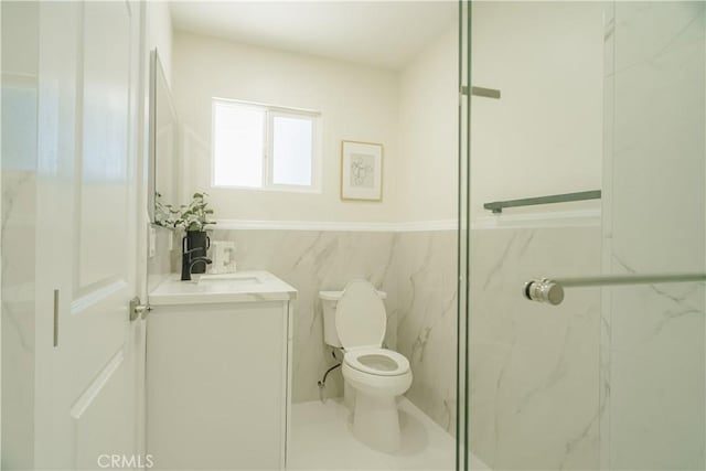 722 W Cully Dr, Orange, CA 92865 - full bath with vanity, a wainscoted wall, a marble finish shower, and tile walls